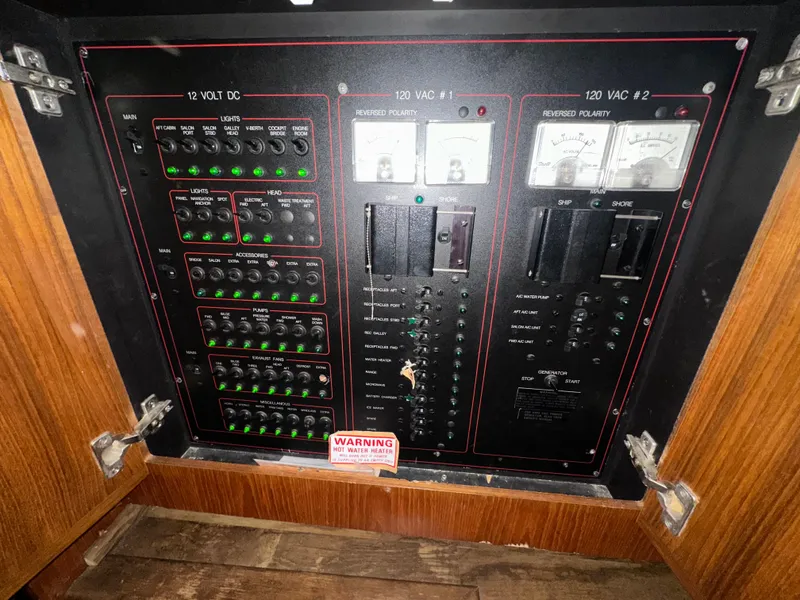 Slide: The Image of 1993 Carver Cruiser 440 electrical panel with switches and gauges. - 34