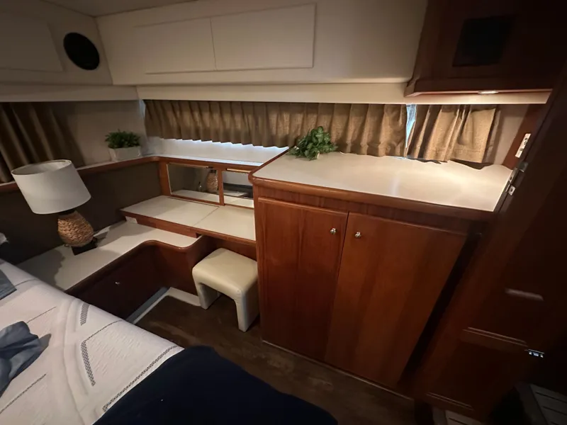 Slide: The Image of 1993 Carver Cruiser 440 yacht interior with wooden furnishings. - 36