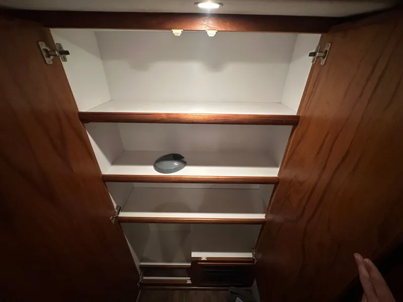 Slide: The Image of Interior of 1993 Carver Cruiser 440 with wooden shelves. - 38