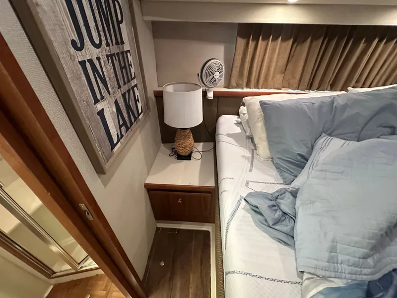 Slide: The Image of 1993 Carver Cruiser 440 interior featuring cozy bedroom setup. - 41