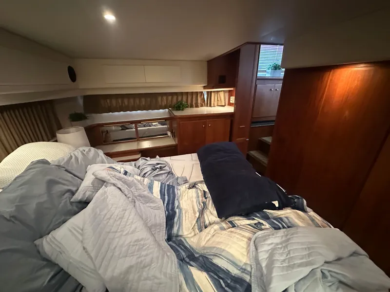 Slide: The Image of Interior of 1993 Carver Cruiser 440 yacht featuring cozy bedroom. - 42