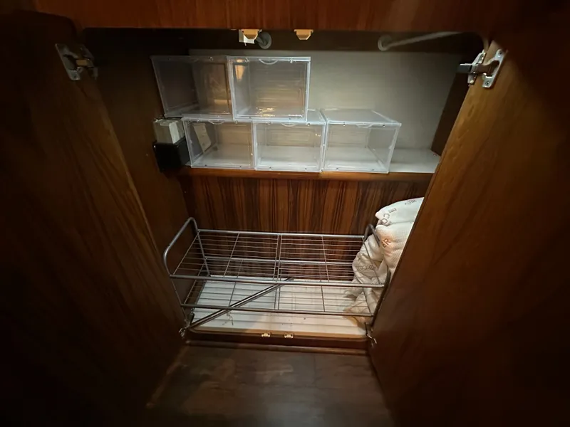 Slide: The Image of Interior of 1993 Carver Cruiser 440 with storage and shelves. - 43