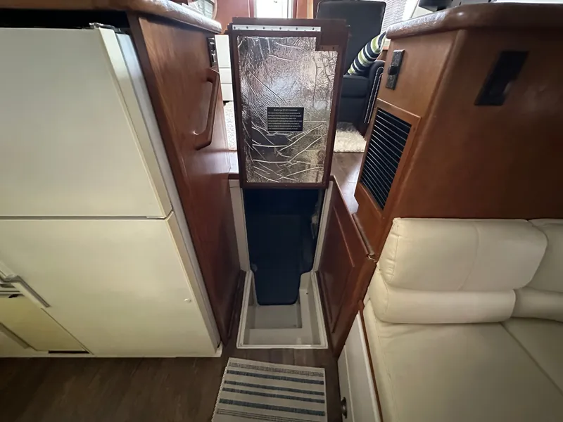 Slide: The Image of Interior of 1993 Carver Cruiser 440 with wooden furnishings. - 44