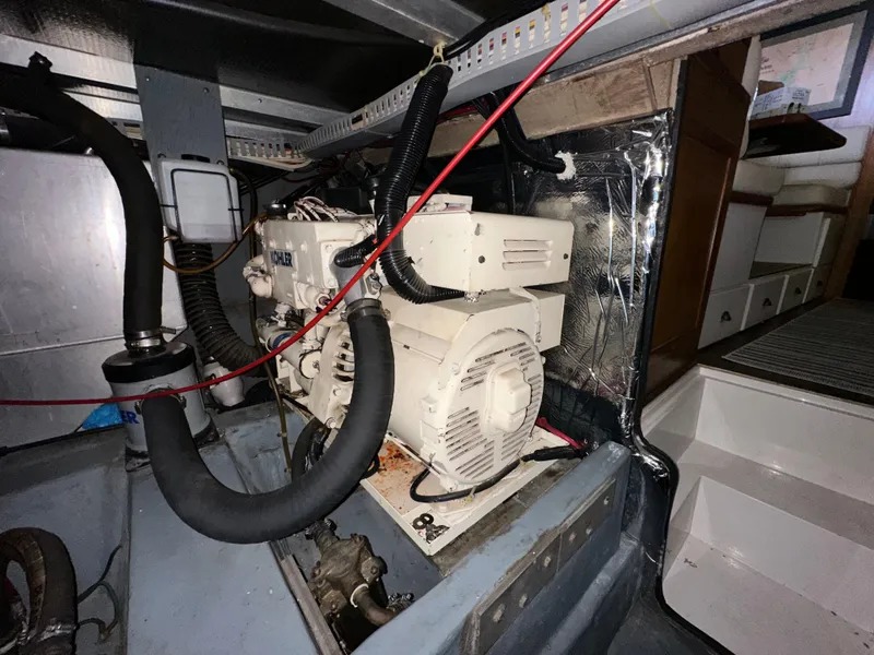 Slide: The Image of Engine room of 1993 Carver Cruiser 440 with generator. - 49