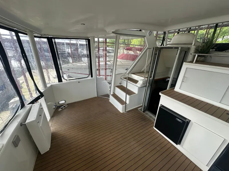 Slide: The Image of Interior of a 1993 Carver Cruiser 440 yacht with wooden flooring. - 6