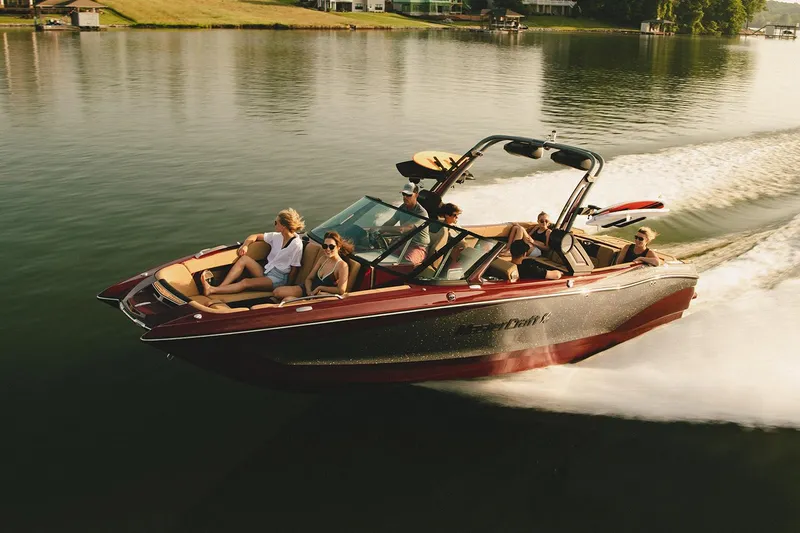 Slide: The Image of Manufacturer Provided Image: 2022 MasterCraft X26 boat cruising on a lake with passengers enjoying the ride. - 3