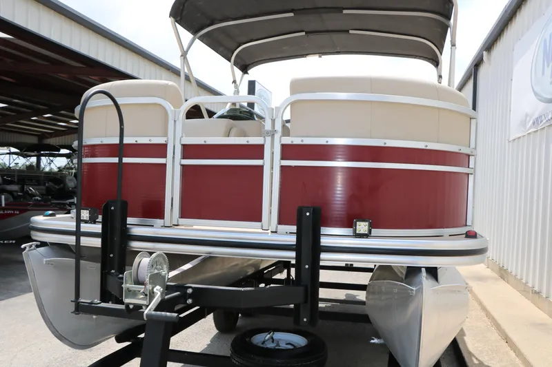 Slide: The Image of 2016 Lowe SS 190 pontoon boat on trailer, featuring red and beige design. - 10