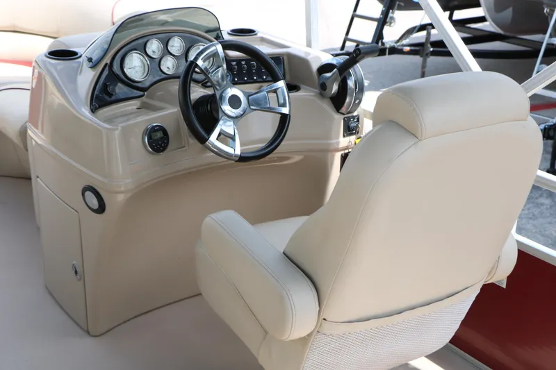 Slide: The Image of 2016 Lowe SS 190 boat helm with beige captain's chair and modern dashboard controls. - 23