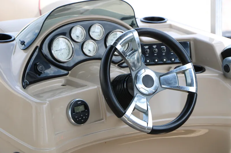 Slide: The Image of Steering console of 2016 Lowe SS 190 boat with gauges and controls. - 24
