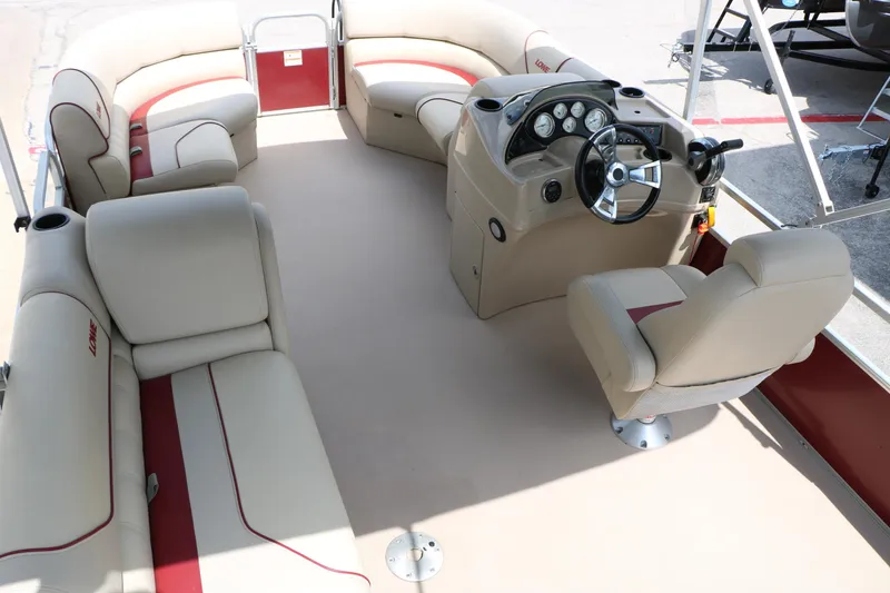 Slide: The Image of 2016 Lowe SS 190 pontoon boat interior with beige seating and steering console. - 26