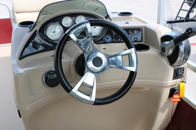 Slide: The Image of Steering console of a 2016 Lowe SS 190 boat with gauges and controls. - 27