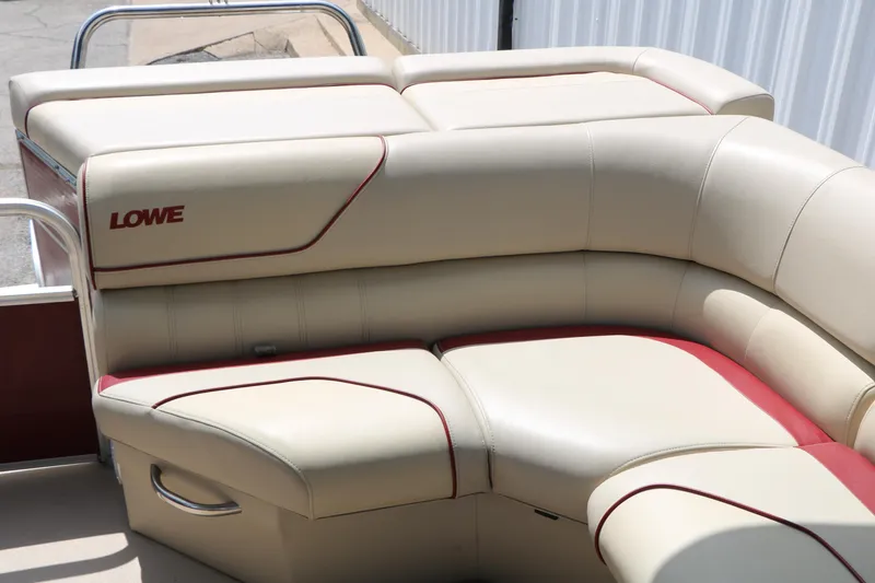 Slide: The Image of 2016 Lowe SS 190 boat interior with beige and red cushioned seating. - 33