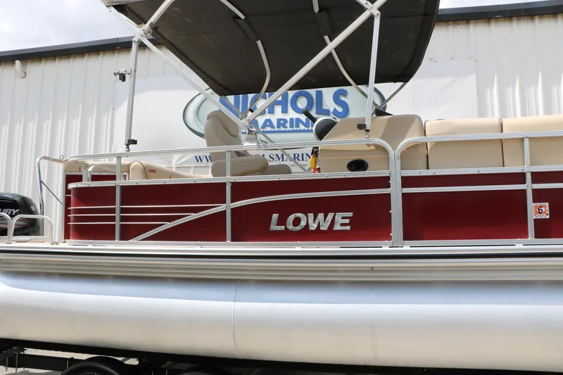 Slide: The Image of 2016 Lowe SS 190 pontoon boat with canopy, displayed at Nichols Marine. - 5