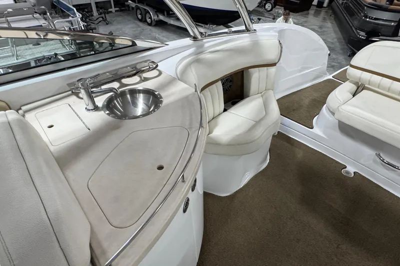 Slide: The Image of Luxurious 2018 Cobalt boat interior with sink, seating, and carpeted flooring. - 10