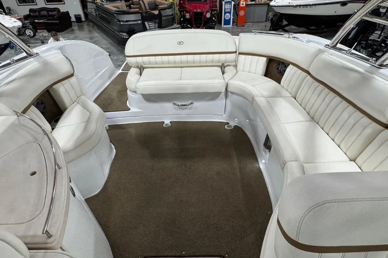 Slide: The Image of Luxurious 2018 Cobalt boat interior with plush white seating and brown accents. - 13