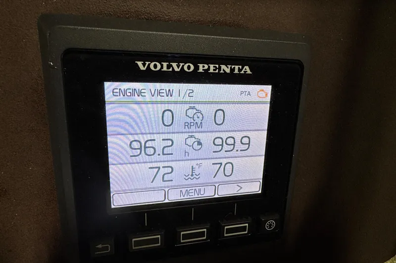 Slide: The Image of Volvo Penta engine display showing RPM, hours, and temperature on a 2018 Cobalt boat. - 21