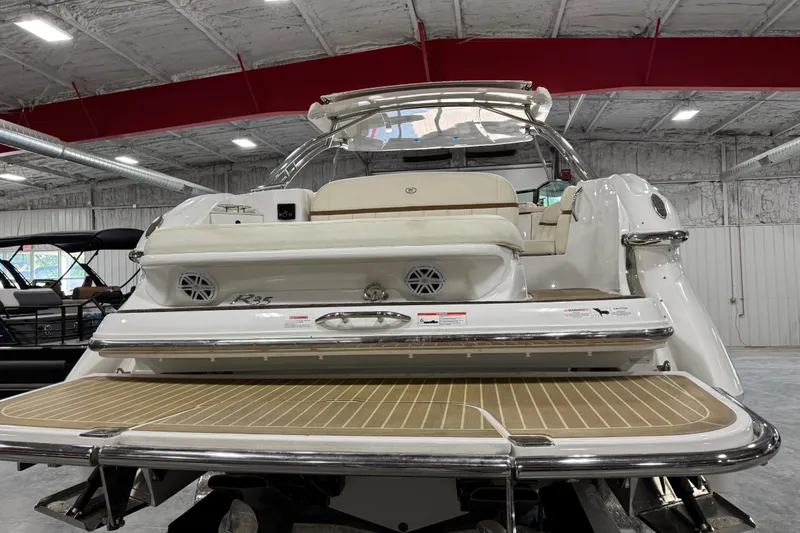 Slide: The Image of 2018 Cobalt R35 boat in showroom, featuring spacious deck and luxurious seating. - 5