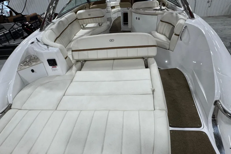 Slide: The Image of Luxurious 2018 Cobalt boat interior with white cushioned seating and sleek design. - 7