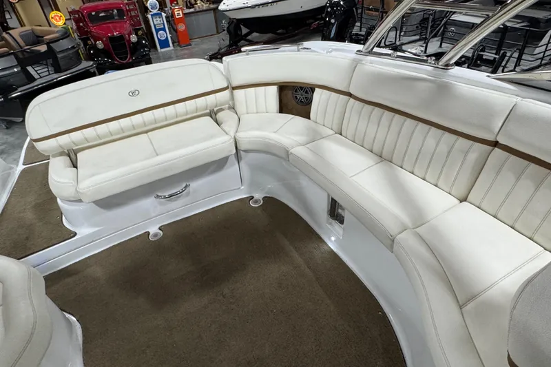 Slide: The Image of Luxurious 2018 Cobalt boat interior with white leather seating and brown accents. - 9