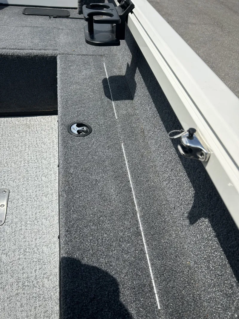Slide: The Image of Interior of 2023 Ranger VS1882 WT boat with gray carpet flooring. - 14