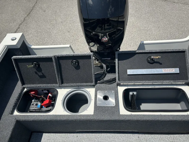 Slide: The Image of 2023 Ranger VS1882 WT boat with storage compartments and motor. - 19