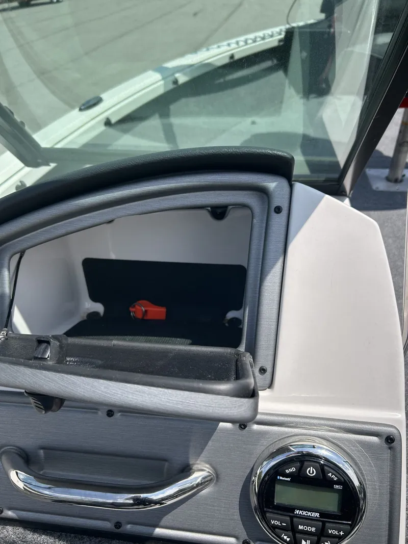Slide: The Image of 2023 Ranger VS1882 WT boat console with controls and storage. - 21