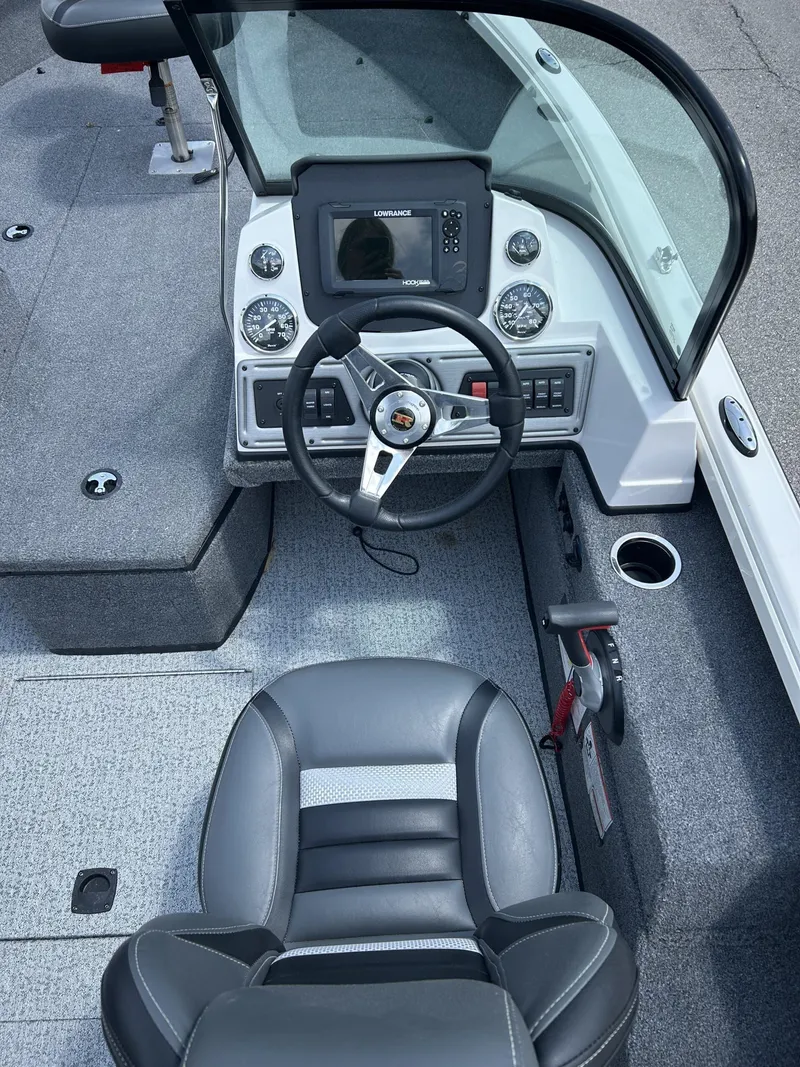 Slide: The Image of Interior view of 2023 Ranger VS1882 WT boat with steering console. - 9
