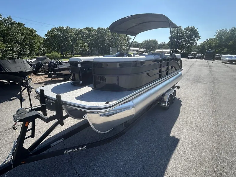Slide: The Image of 2024 Lowe SS230 WV pontoon boat on trailer outdoors. - 5
