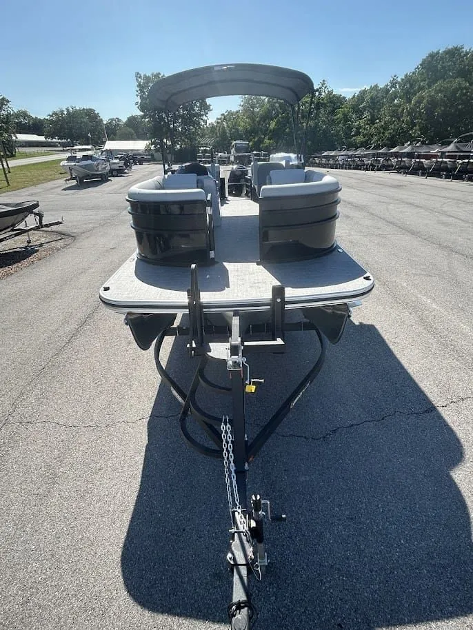 Slide: The Image of 2024 Lowe SS230 WV pontoon boat on trailer outdoors. - 6