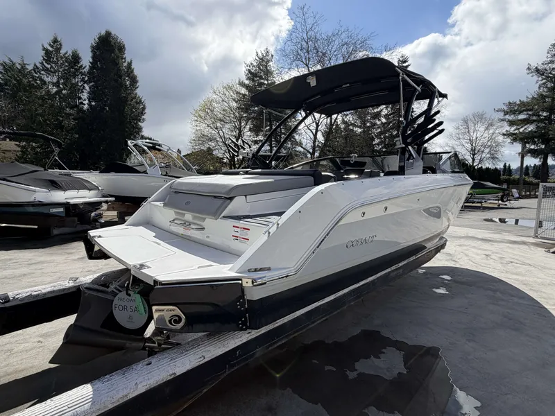 Slide: The Image of 2025 Cobalt CS23 Surf boat on trailer, ready for sale. - 3