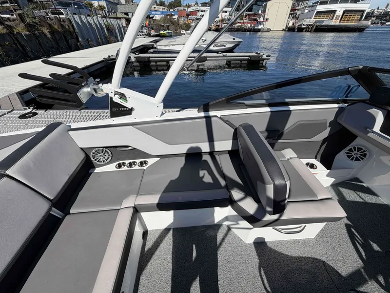 Slide: The Image of Interior of 2025 Cobalt CS23 Surf with gray seating at the dock. - 12