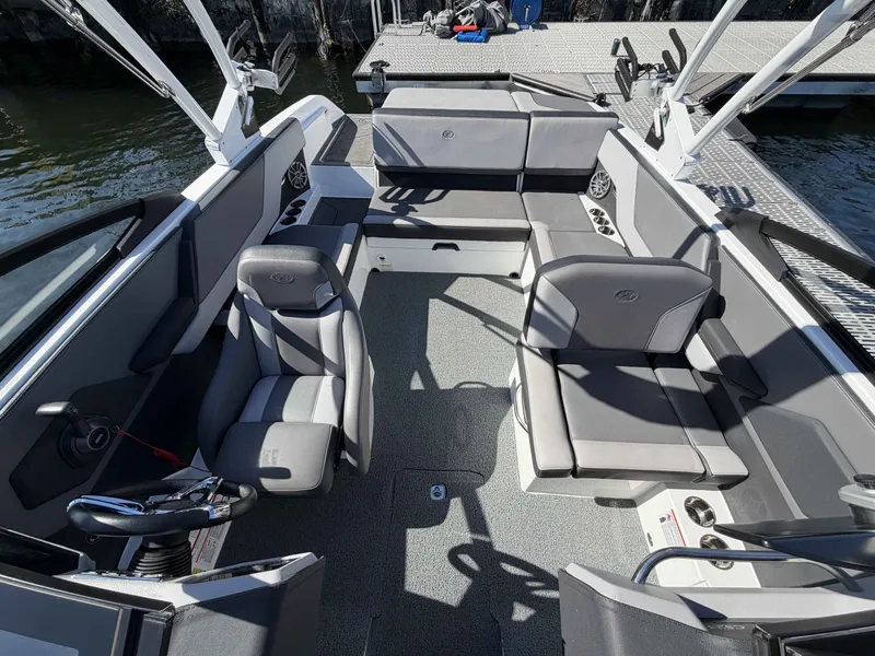 Slide: The Image of Interior of 2025 Cobalt CS23 Surf with gray seating. - 16