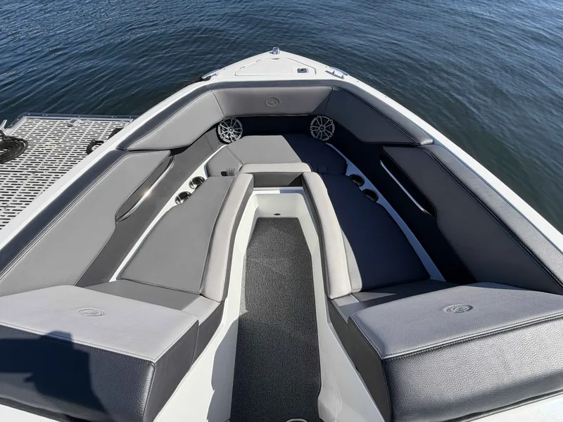 Slide: The Image of Interior view of 2025 Cobalt CS23 Surf boat with gray seating. - 17