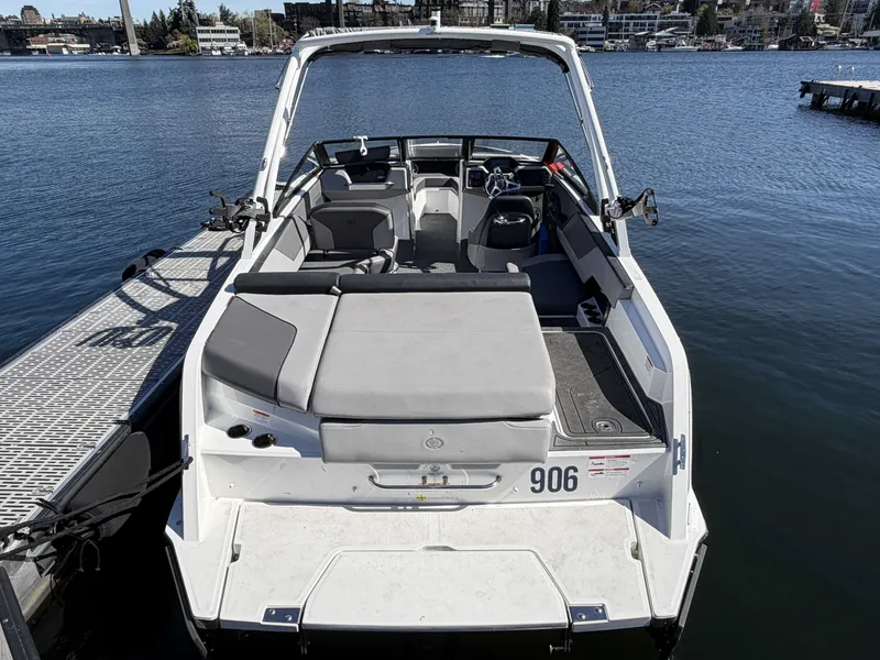 Slide: The Image of 2025 Cobalt CS23 Surf boat at dock, interior view. - 5