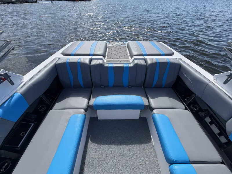 Slide: The Image of Interior of 2025 Malibu Wakesetter 22 LSV with blue and gray seating. - 14