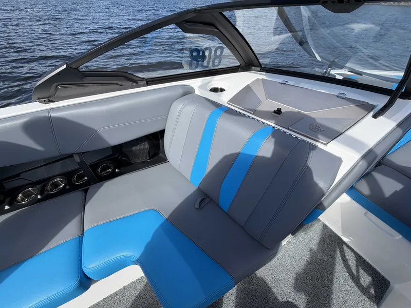 Slide: The Image of 2025 Malibu Wakesetter 22 LSV interior with blue and gray seating. - 17