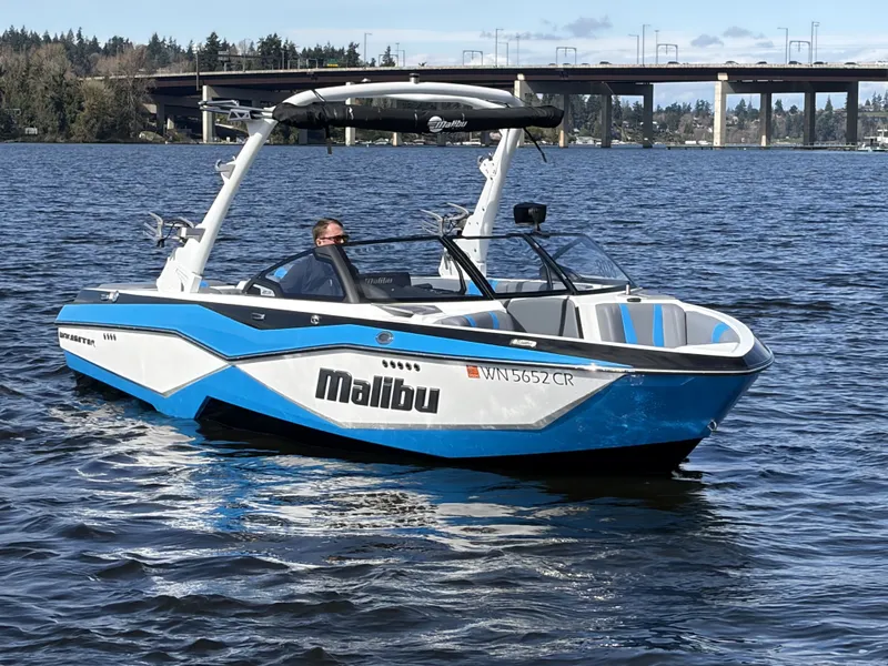 Slide: The Image of 2025 Malibu Wakesetter 22 LSV on a calm lake. - 3
