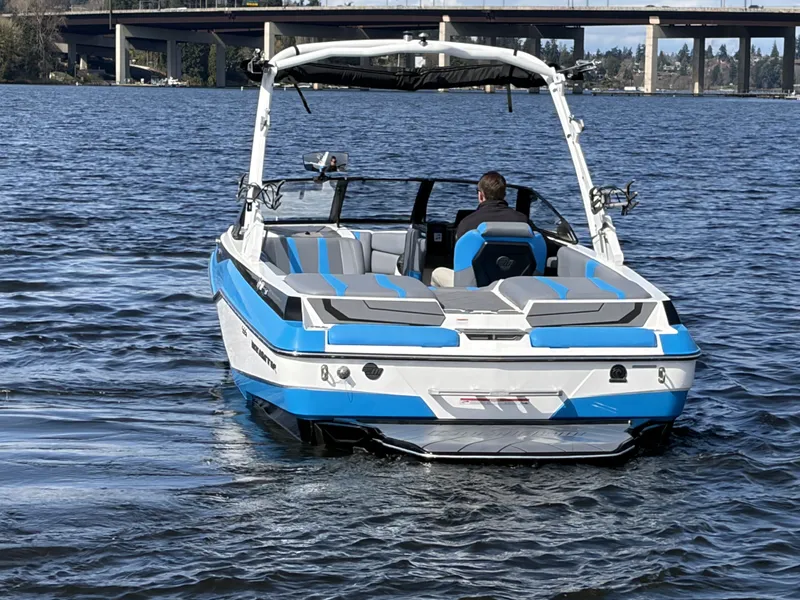 Slide: The Image of 2025 Malibu Wakesetter 22 LSV on a calm lake. - 7