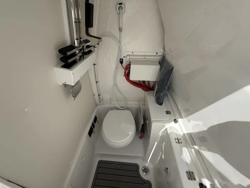 Slide: The Image of Interior of 2026 Tidewater 272 CC Adventure with toilet and storage. - 11