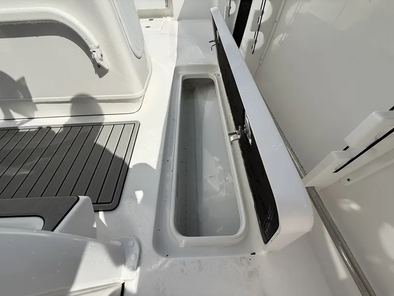 Slide: The Image of Tidewater 272 CC Adventure 2026 with open storage compartment lid. - 12