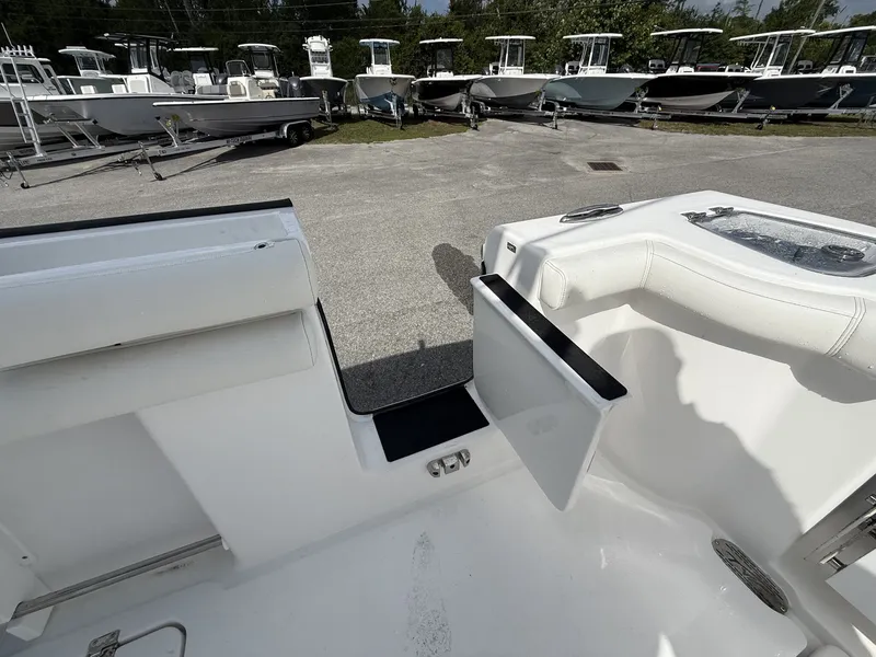 Slide: The Image of Tidewater 272 CC Adventure 2026 with open door, boats in background. - 18