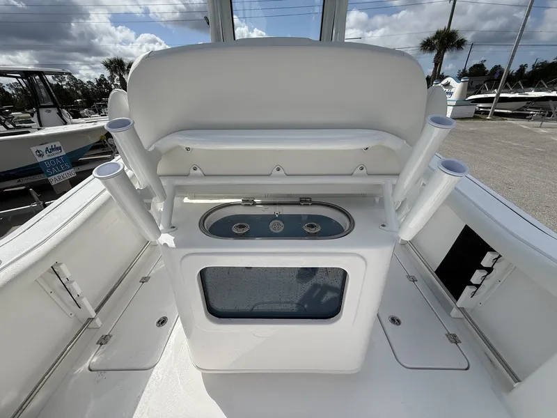 Slide: The Image of 2026 Tidewater 272 CC Adventure with rod holders and storage compartment. - 19