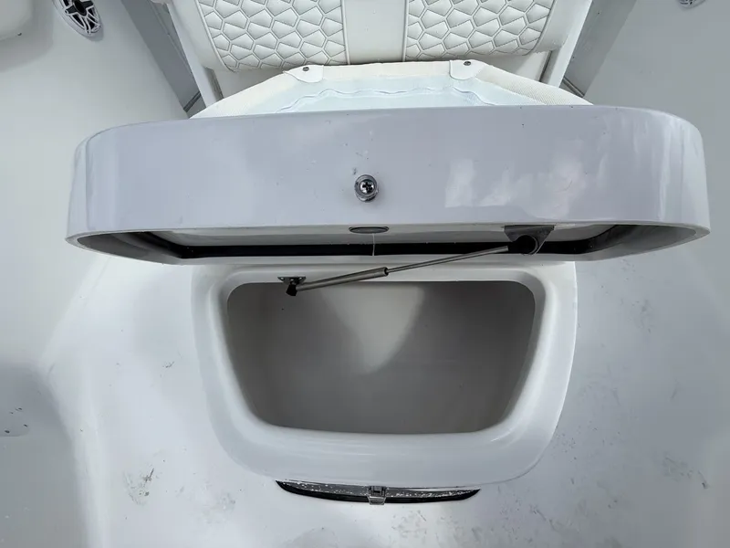Slide: The Image of Open storage compartment on a 2026 Tidewater 272 CC Adventure boat. - 7