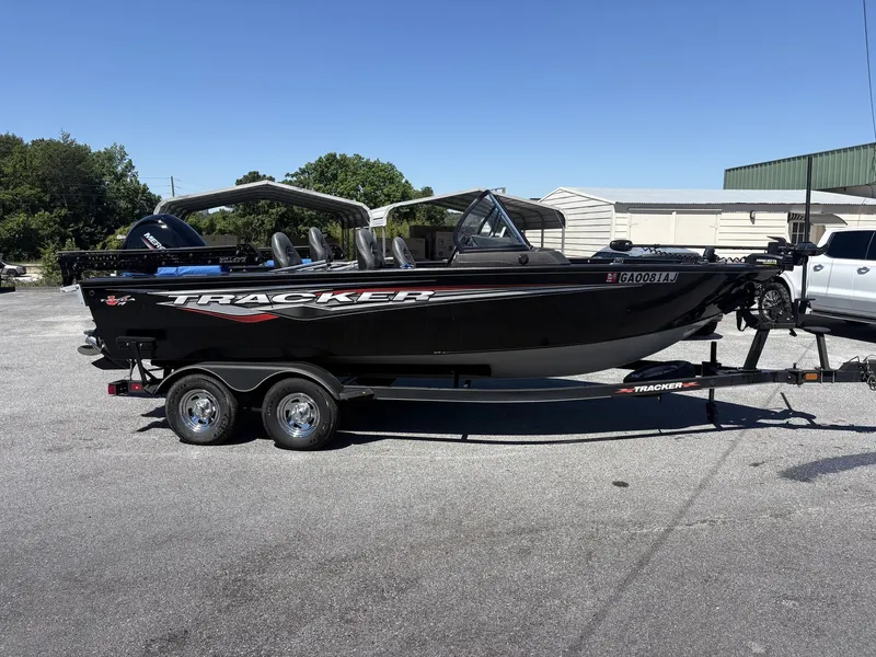 Slide: The Image of 2022 Tracker Targa V19 boat parked on trailer outdoors. - 11