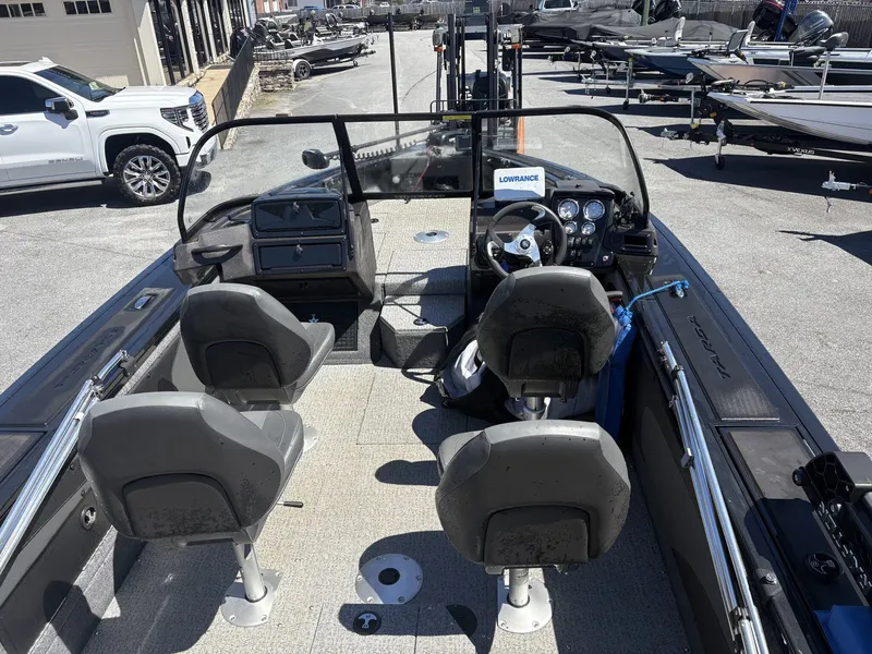 Slide: The Image of Interior view of a 2022 Tracker Targa V19 boat in a parking lot. - 9