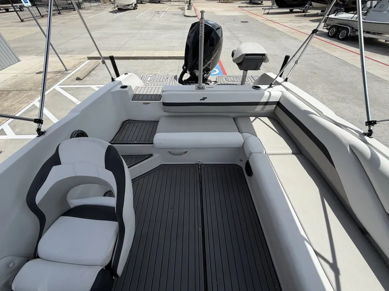 Slide: The Image of Interior of 2023 Starcraft SXV-211 boat, featuring modern seating and flooring. - 13