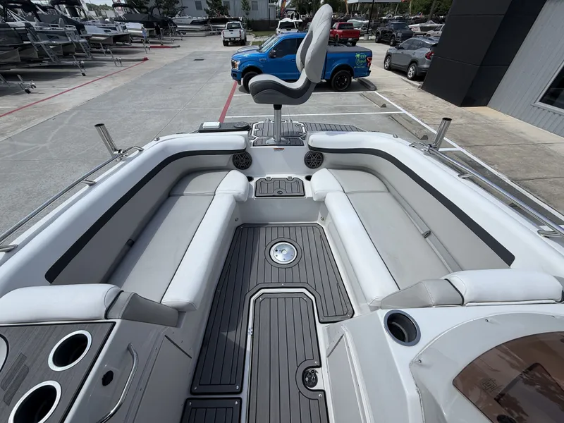 Slide: The Image of Interior of Starcraft SXV-211 boat, 2023 model, featuring gray seating. - 20