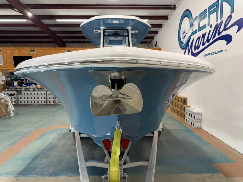 Slide: The Image of 2026 Tidewater 232 CC Adventure boat in a showroom. - 12