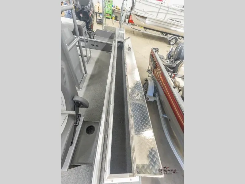 Slide: The Image of Rush 209 boat 2026 with open storage compartment lid. - 14