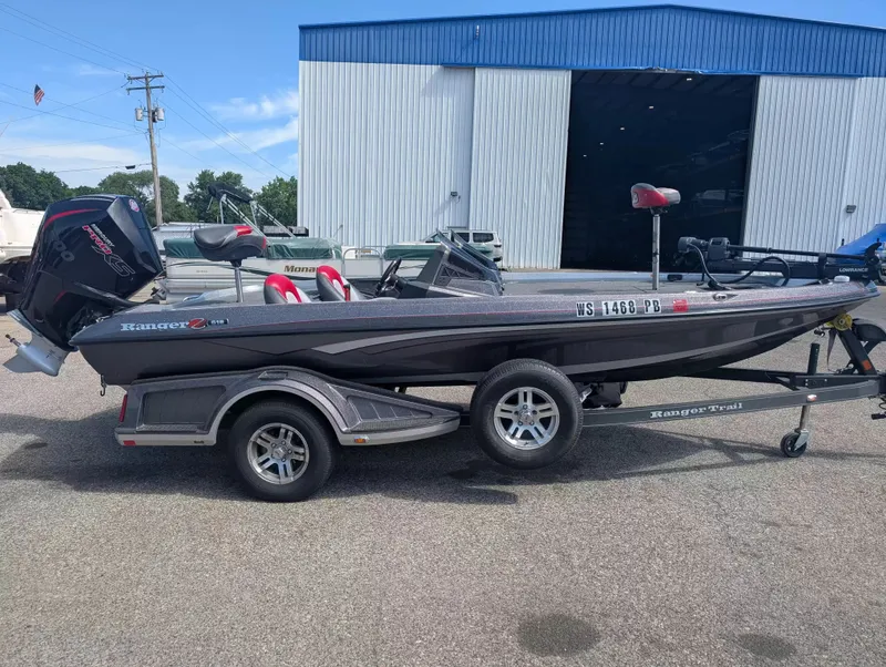 The Image of 2020 Ranger Z518 boat on trailer in front of warehouse. - 1